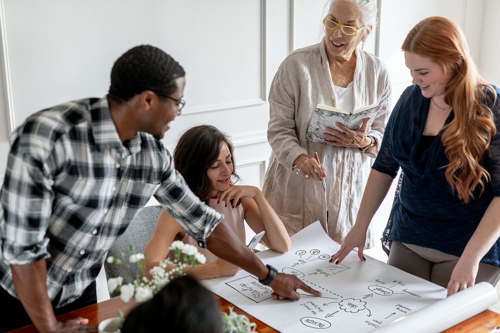 Business people brainstorming on a paper