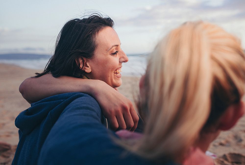 Cheerful friends on the beach