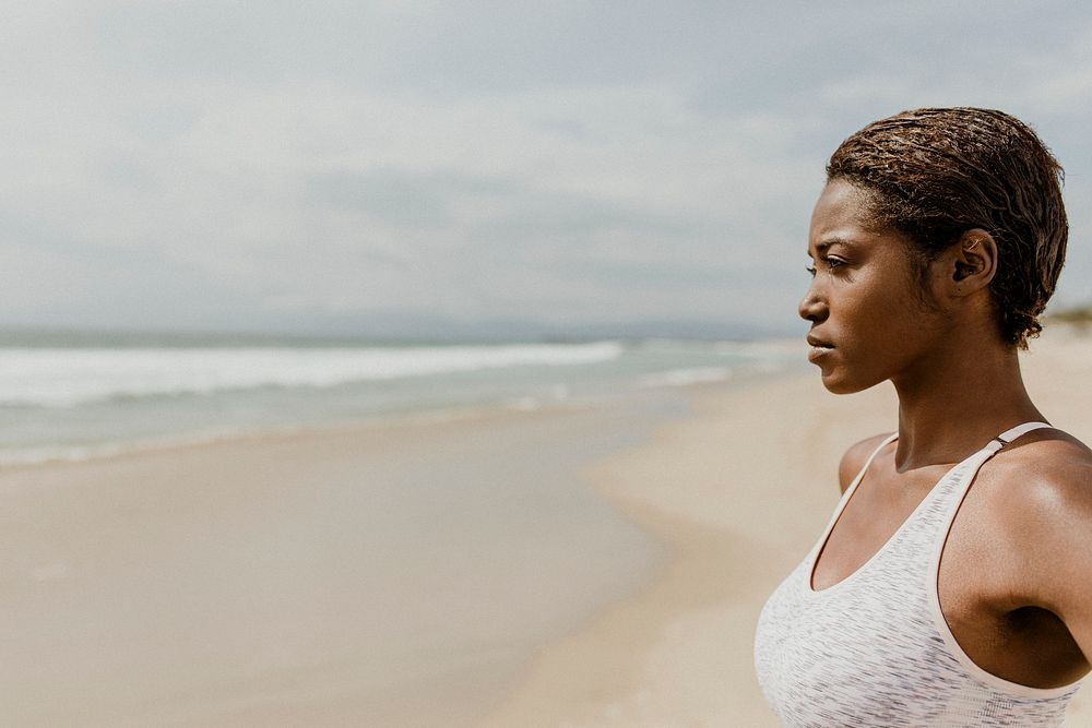 Confident black woman on the beach