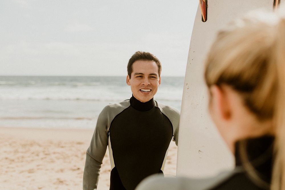 Surfers talking at the beach