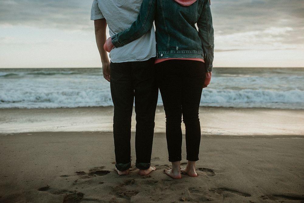 Young couple hugging at the beach