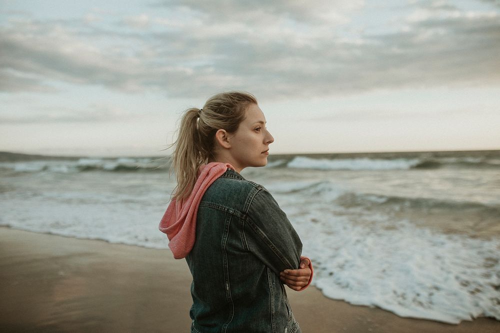 Woman on a gloomy beach