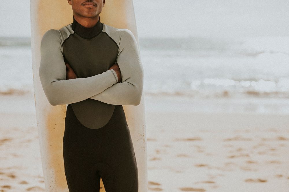 Black man with a surfboard