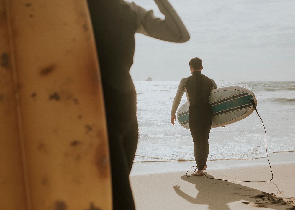 Surfers at the beach on a sunny day
