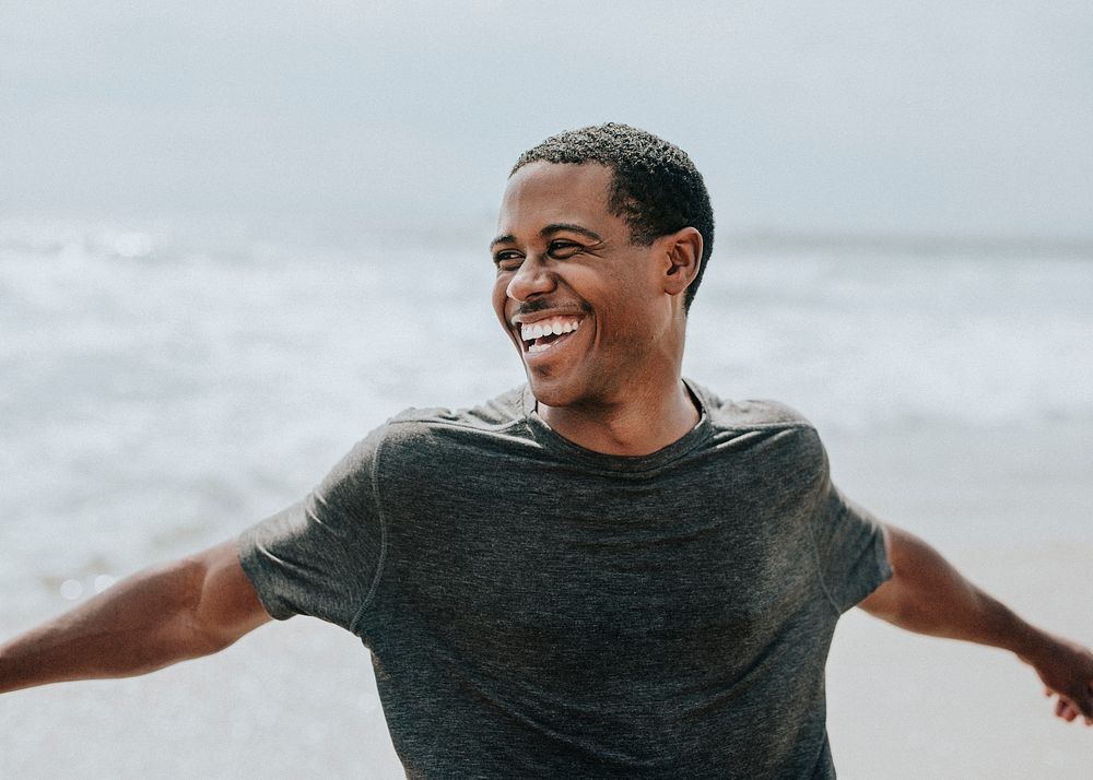 Cheerful man enjoying on the beach