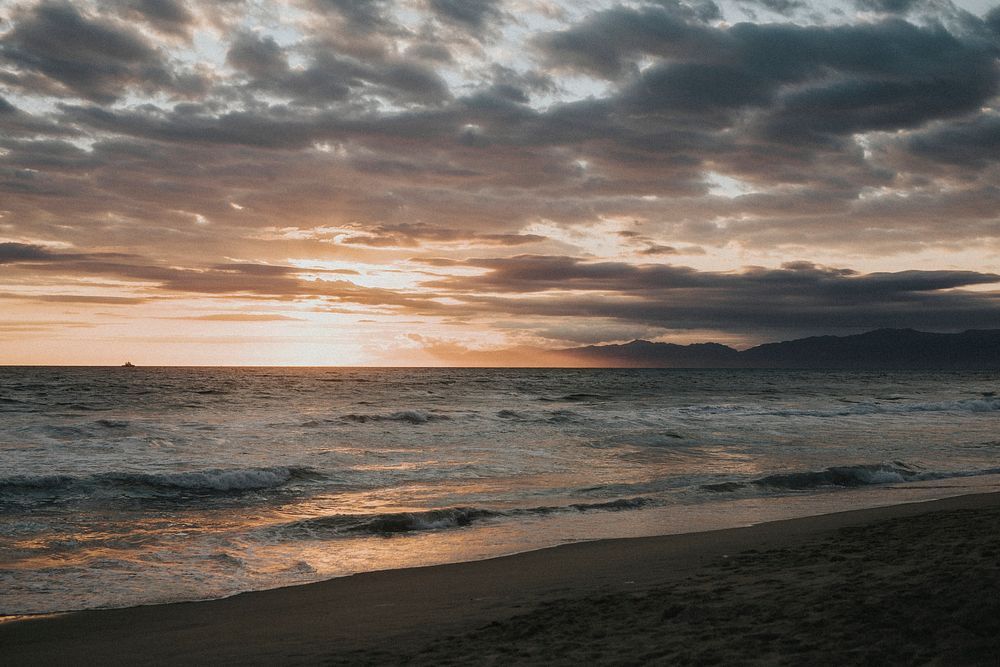 Scenic gloomy sunset on the beach