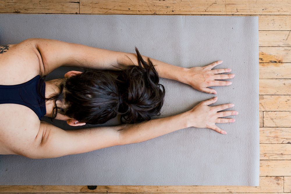 Active woman doing yoga in the room