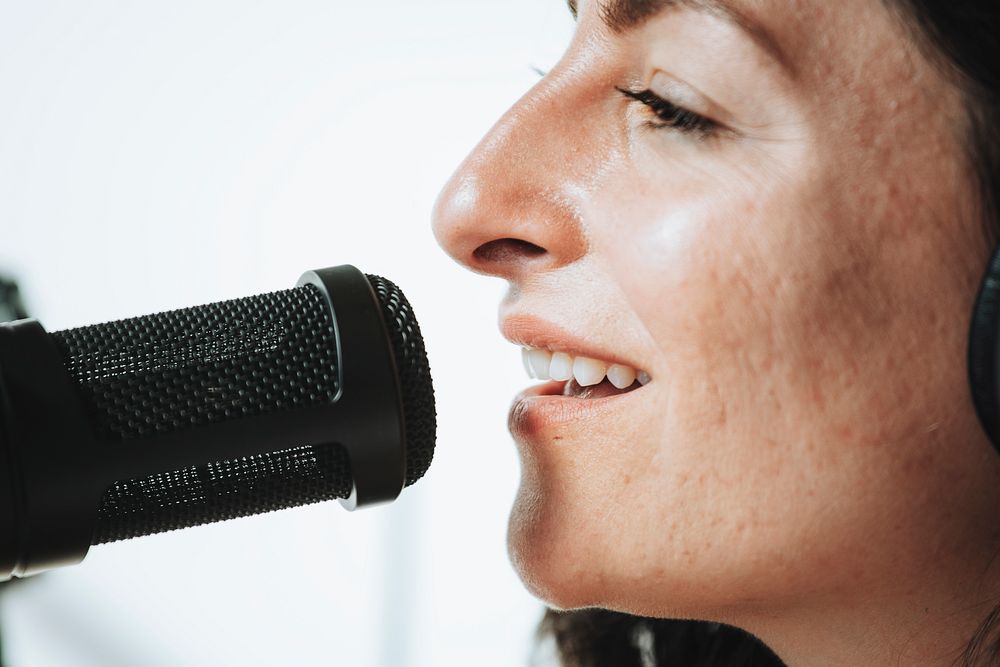 Female singer singing live in a studio