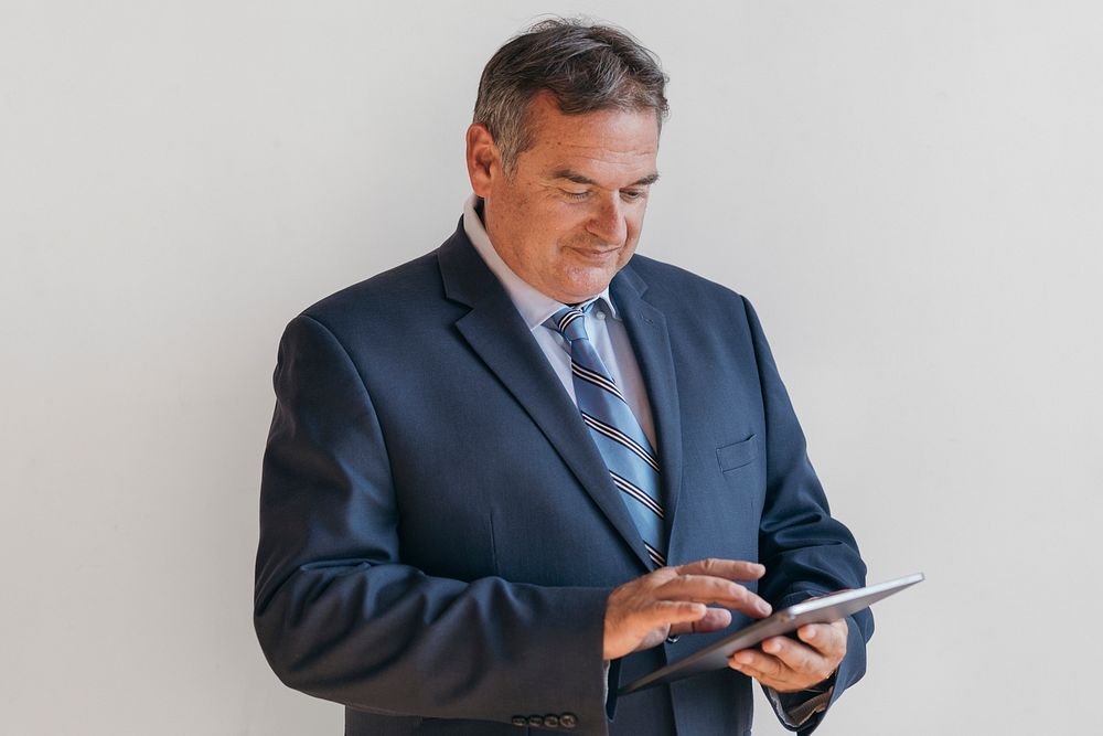 Businessman using a digital tablet mockup