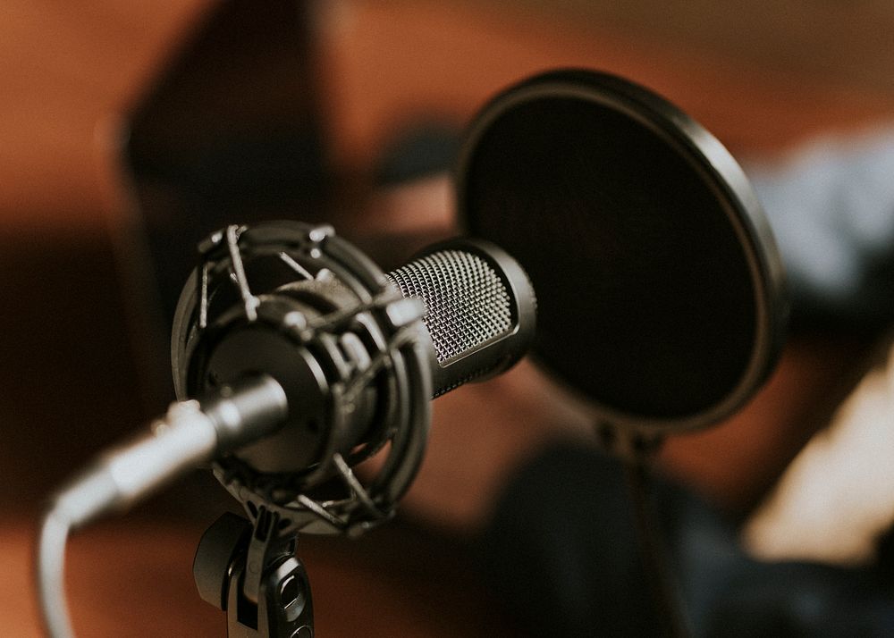Condense microphone with a pop filter in a studio