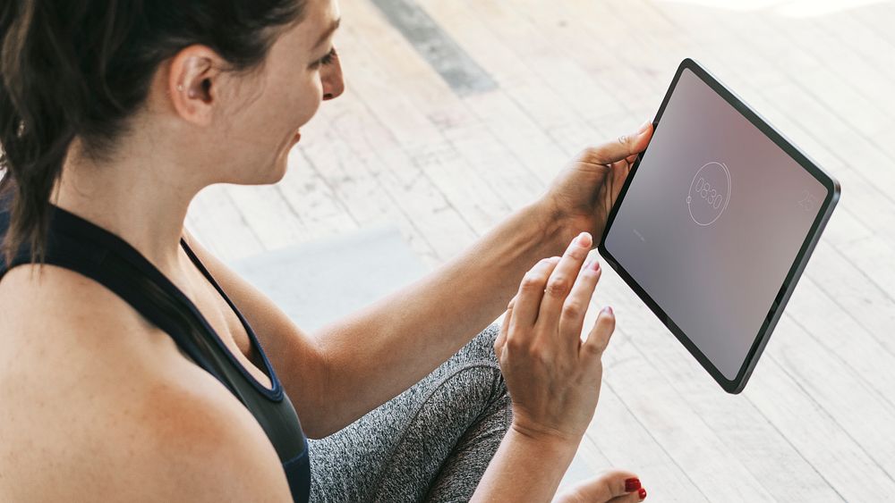 Yoga instructor using a digital tablet mockup mobile phone wallpaper