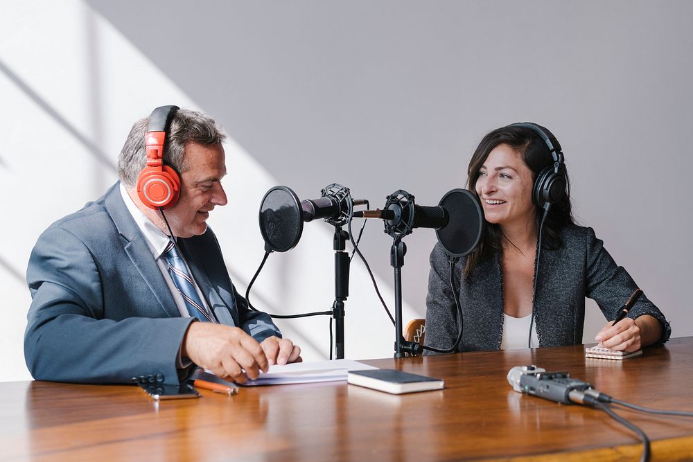Female broadcaster interviewing her guest in a studio