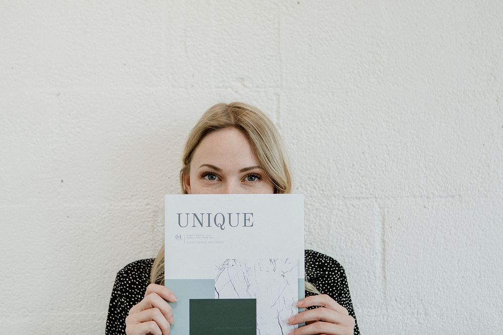 Woman holding a unique magazine
