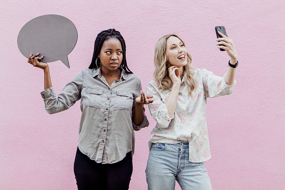 Black woman tired of her friend keep taking a selfie