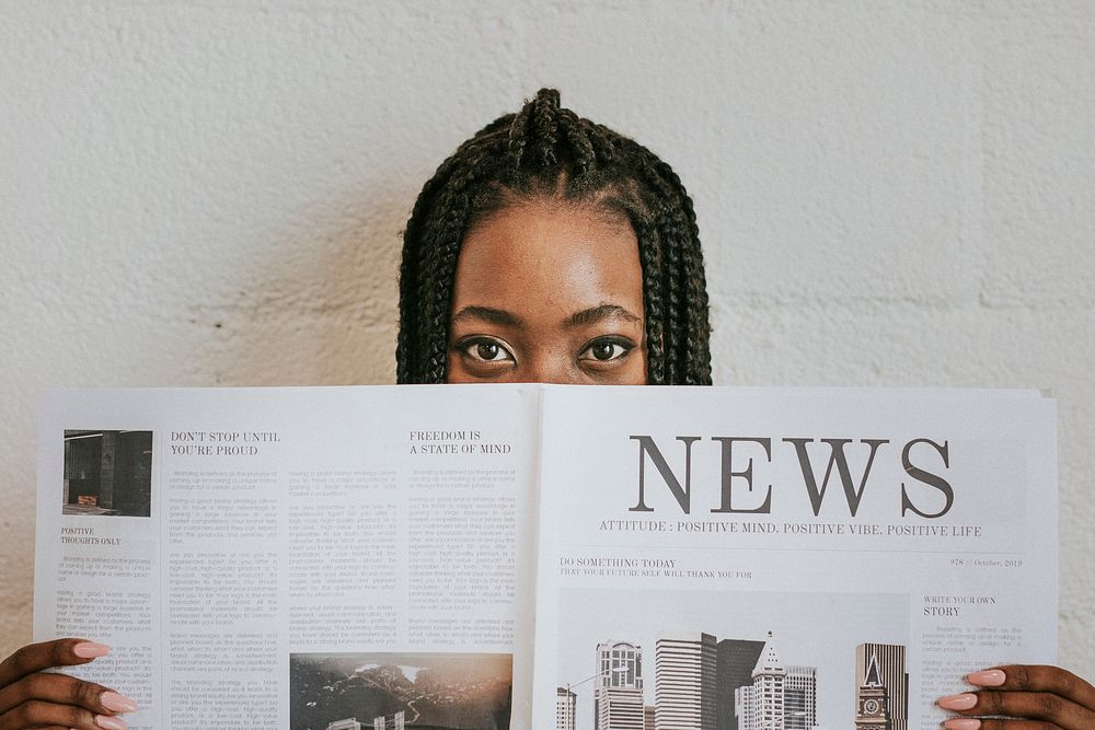 Black woman reading a newspaper