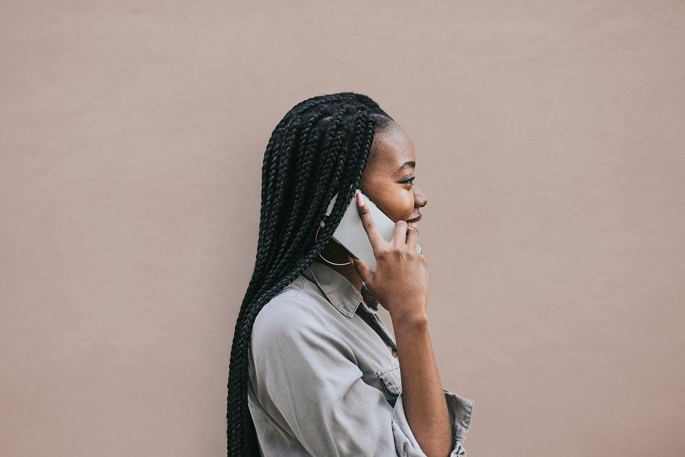 Happy black woman speaking on a phone mockup