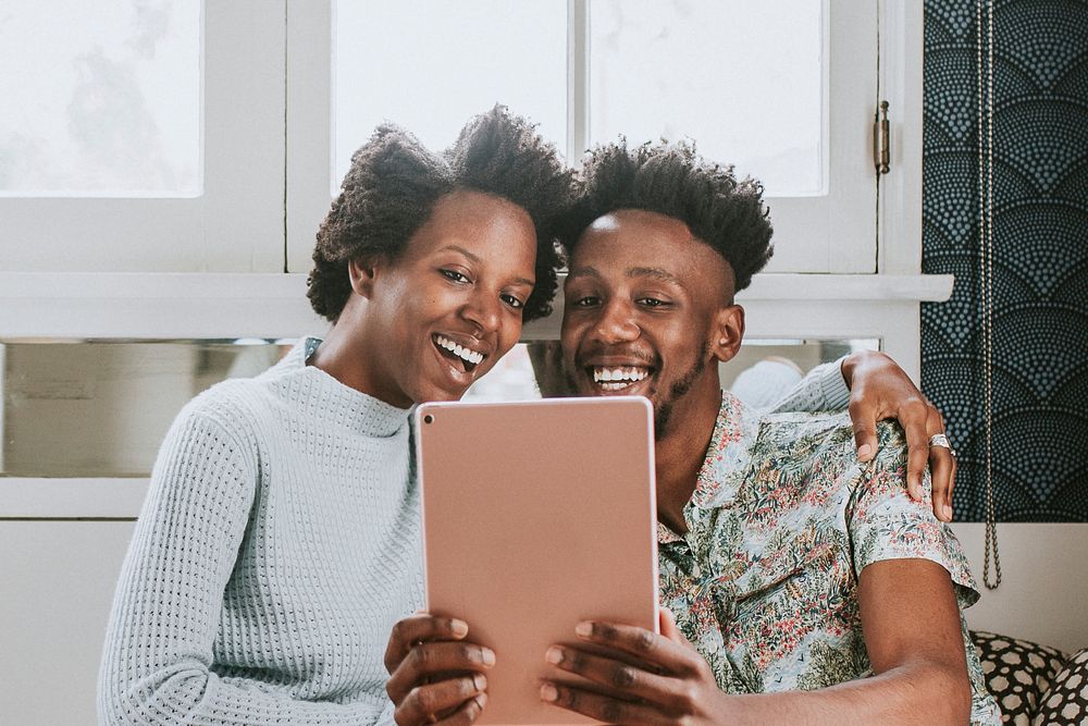 Black couple using a tablet together