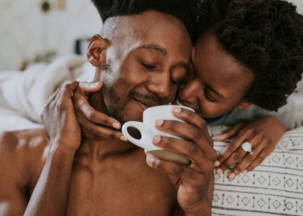 Black couple drinking coffee in the morning