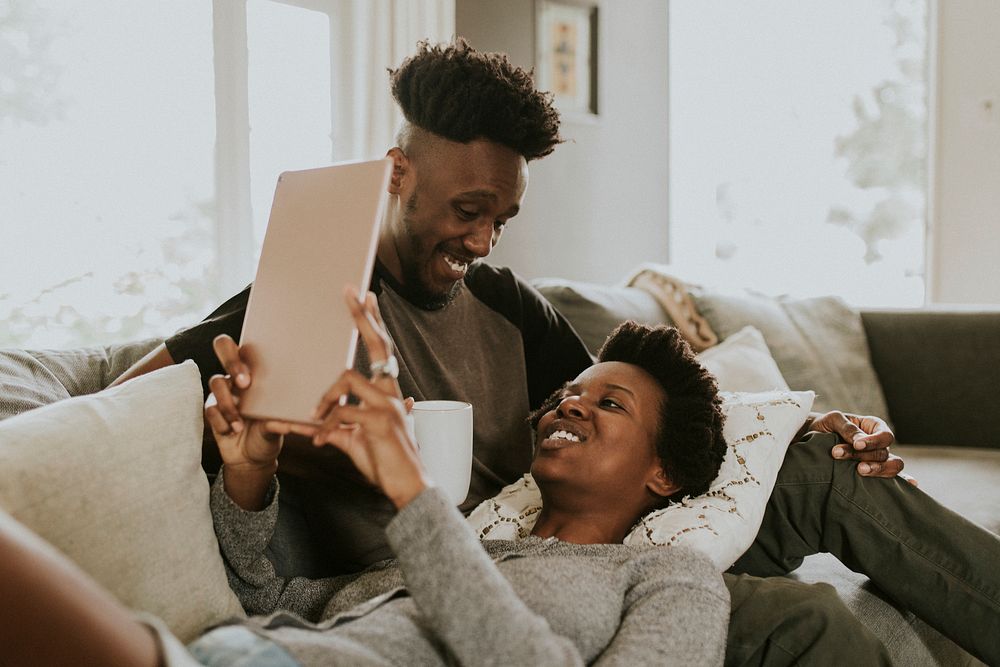 Black couple using a tablet together