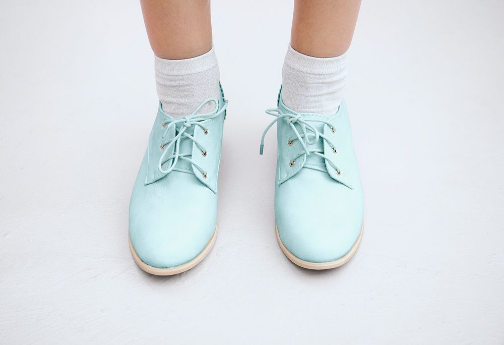 Woman in a pastel blue oxford shoes