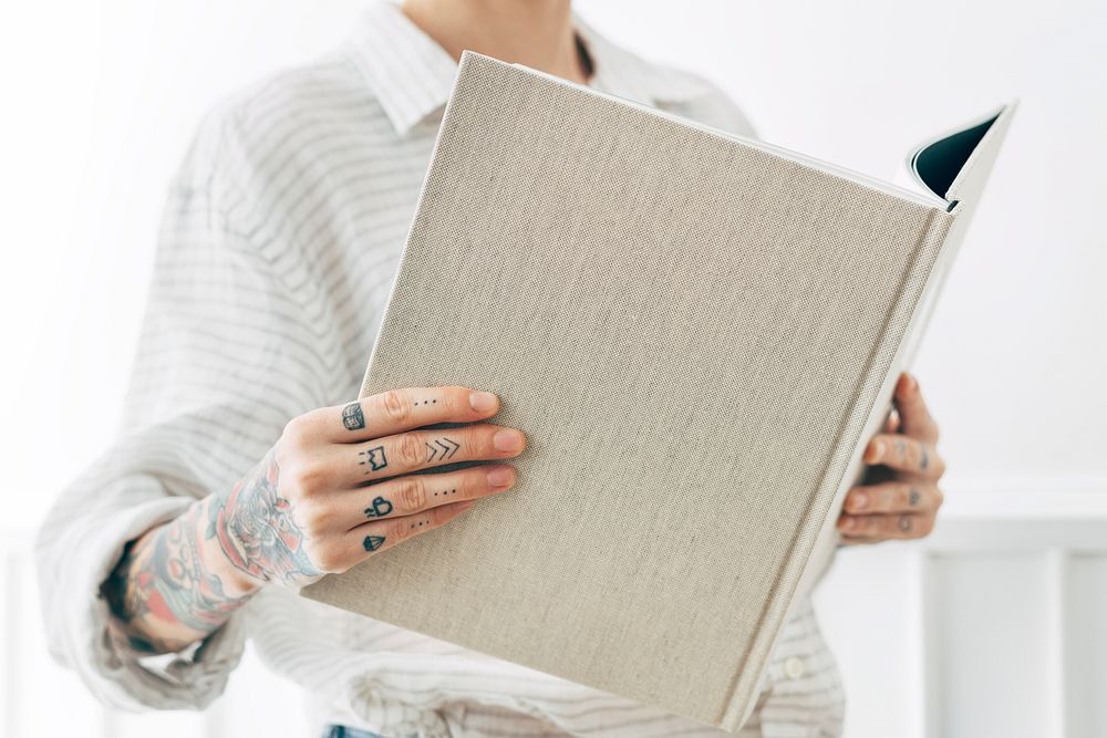 Tattooed woman reading a book mockup