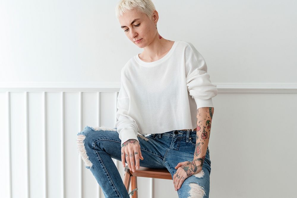 Casual woman sitting on a stool