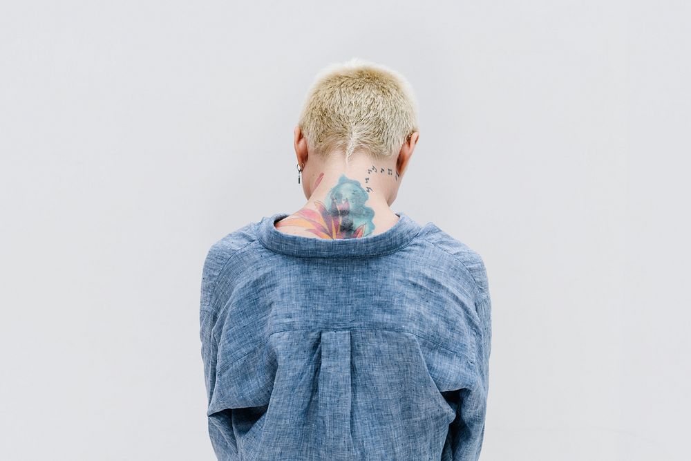 Cool blond hair woman in a blue linen shirt