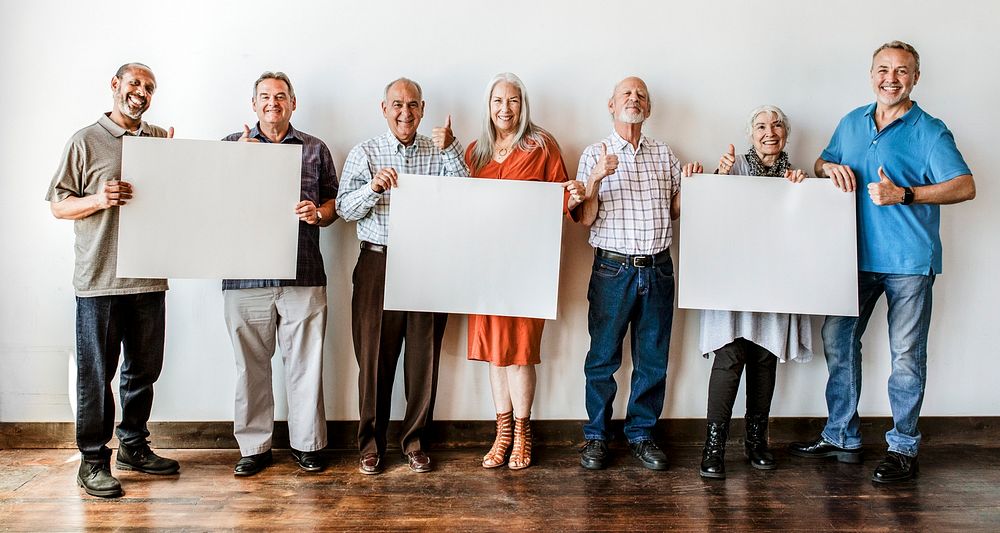 Elderly people holding blank posters mockup