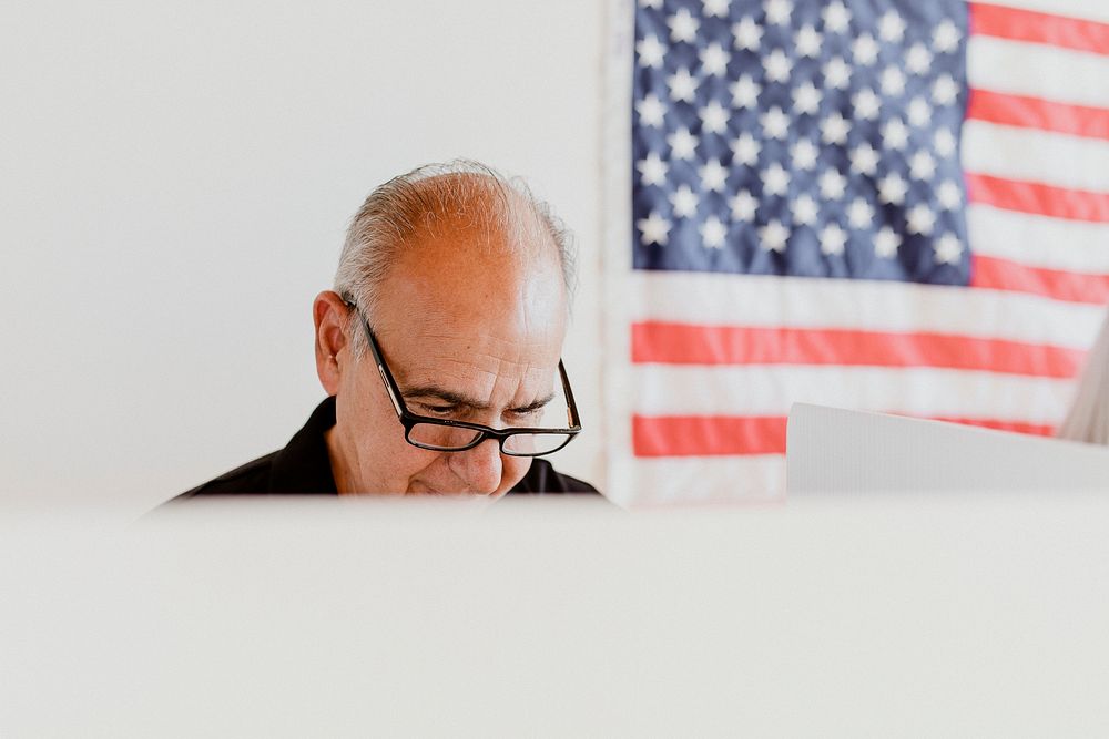 Elderly American man at a polling booth