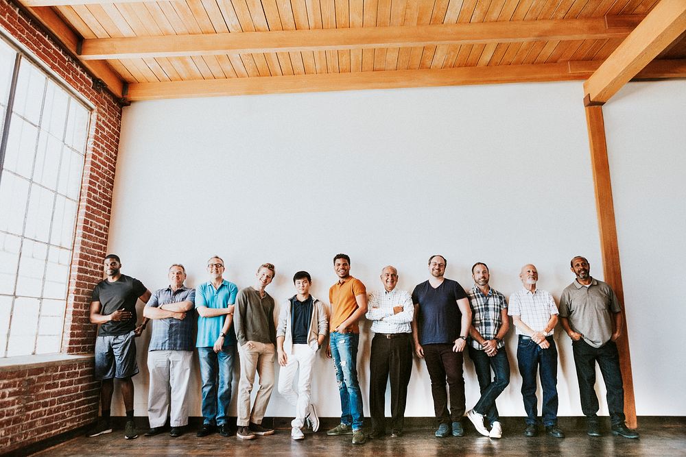 Cheerful diverse men standing in a row