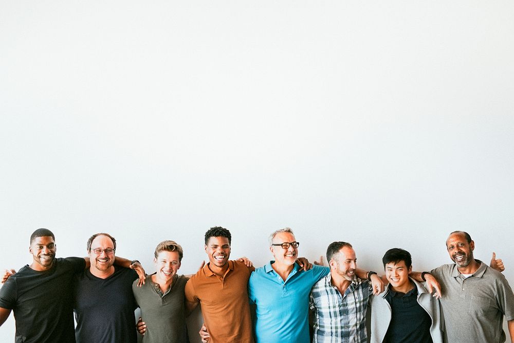 Cheerful diverse men standing in a line