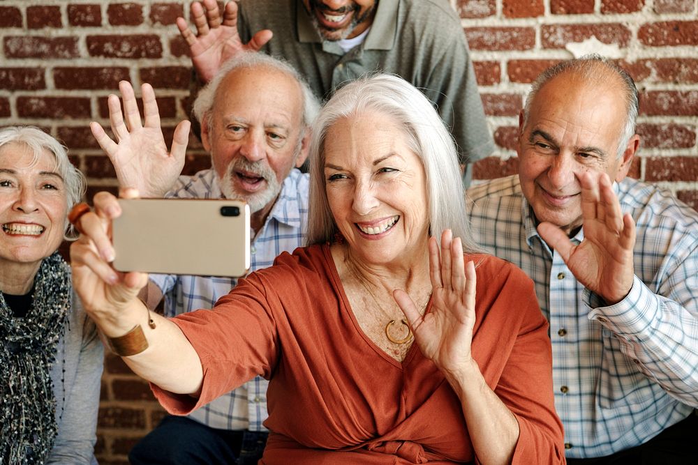 Old people waving to the video calling