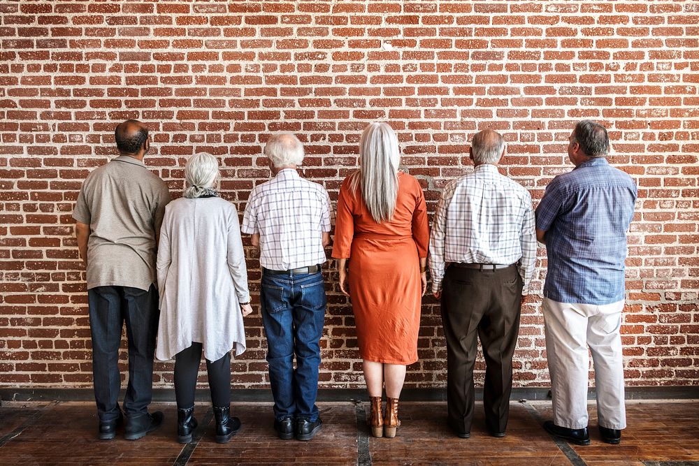 Rear view of elderly people standing together