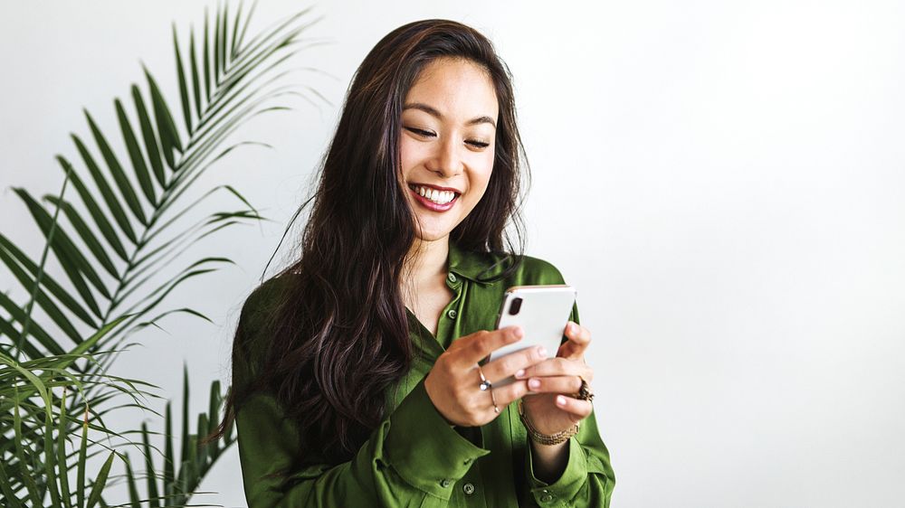 Cheerful woman using a smartphone