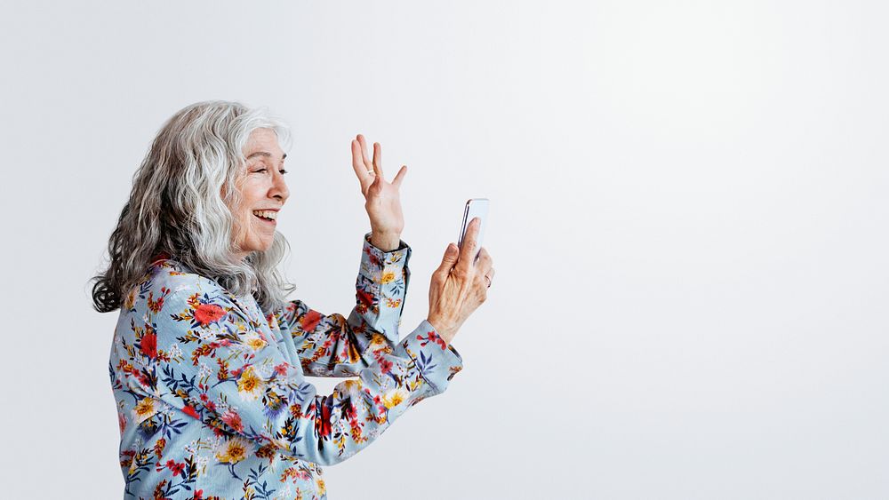 Happy woman waving hello to a smartphone social template
