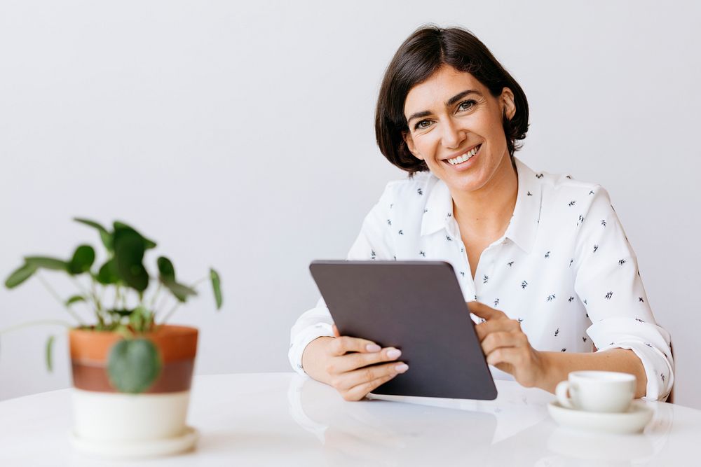 Cheerful businesswoman with a digital tablet social template