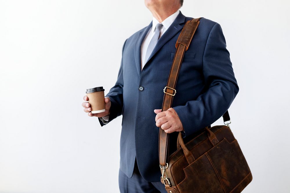 Businessman having take away coffee
