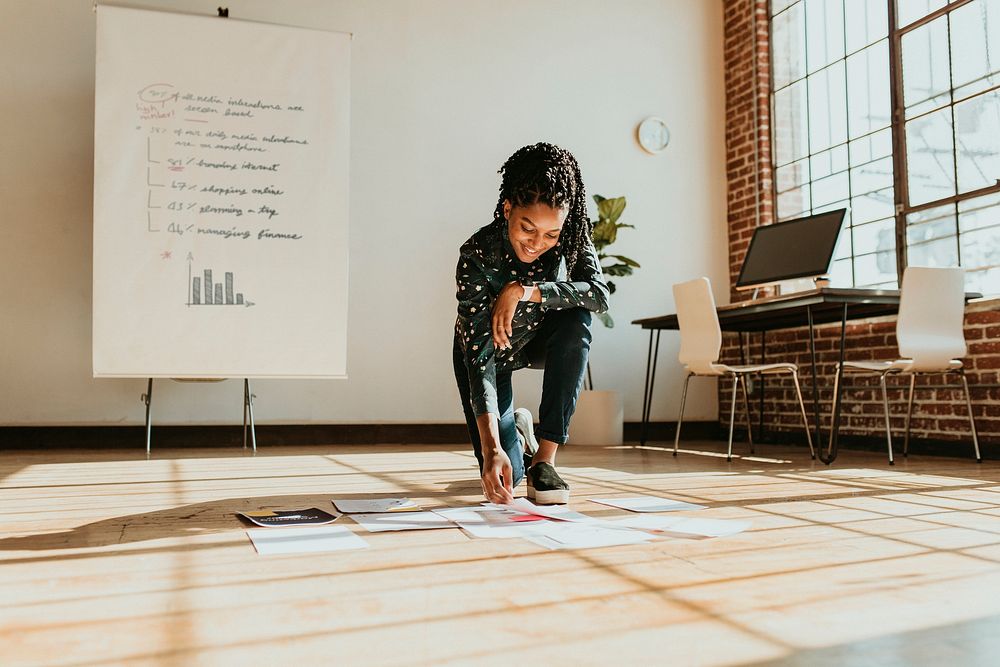 Businesswoman planning a marketing strategy on a wooden floor