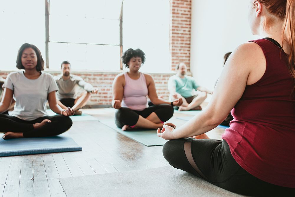 People meditating in a yoga class