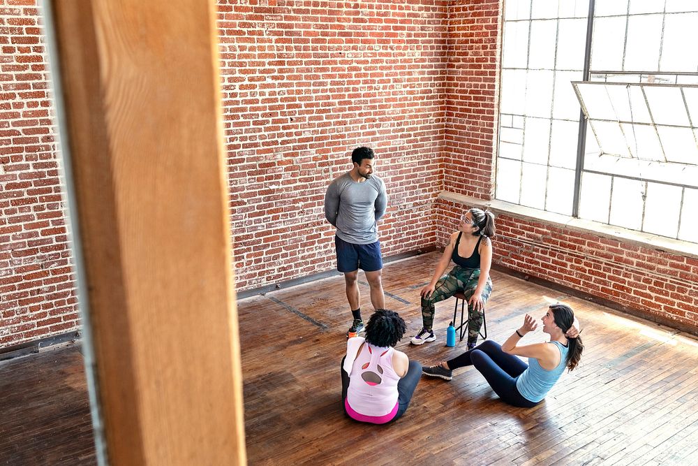 Diverse sporty people resting after a tough workout