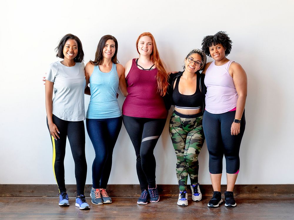 Happy female workout team at the gym