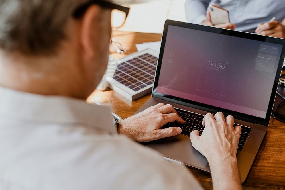 Eco-friendly engineer using a laptop