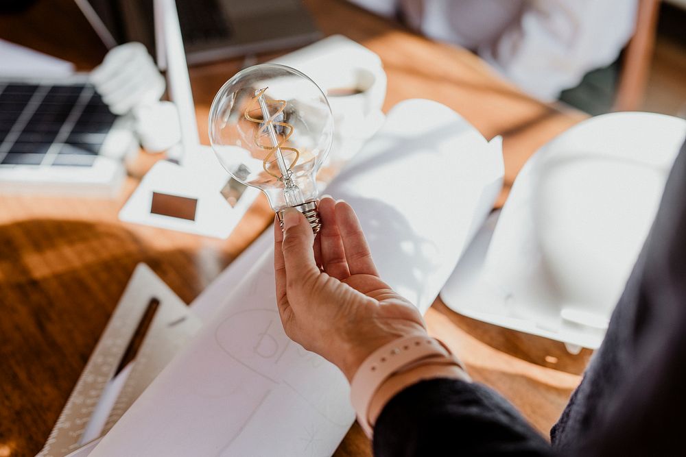 Creative man holding a light bulb