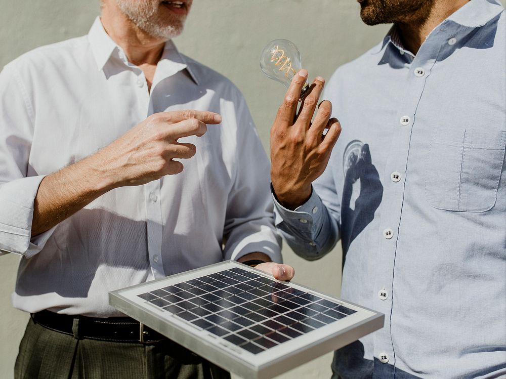 Eco-friendly engineering team with the solar panel