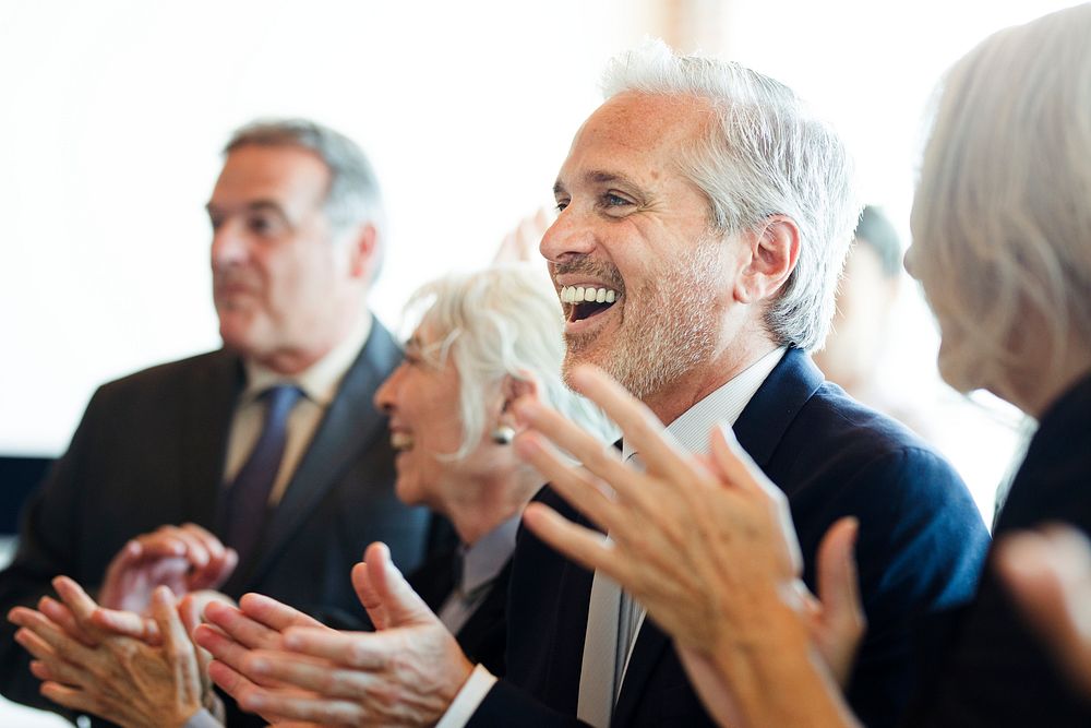 Diverse business people applauding with joy