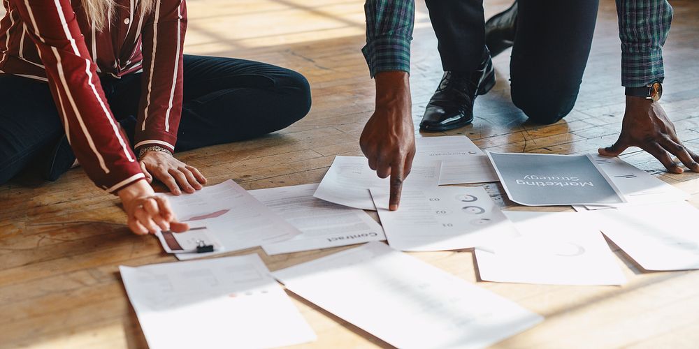 Paperwork on a wooden floor