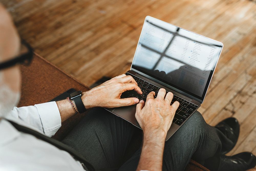 Businessman typing on his laptop