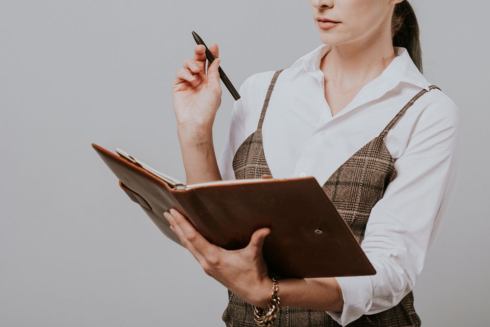 Businesswoman holding a personal notebook