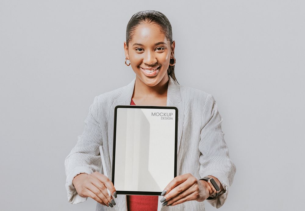 Happy businesswoman with a digital tablet