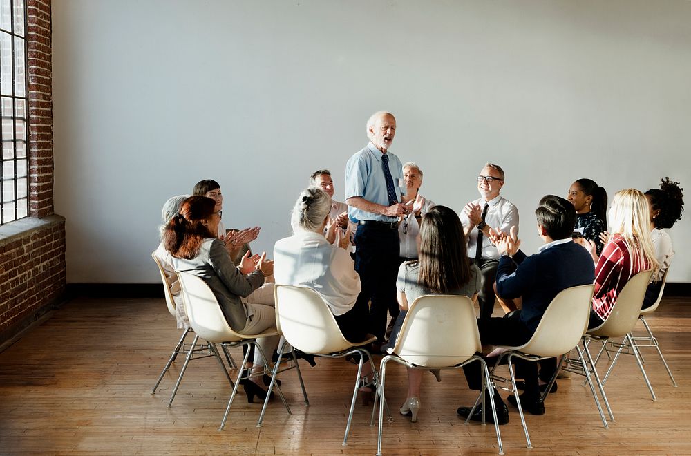 People sitting and talking with a group